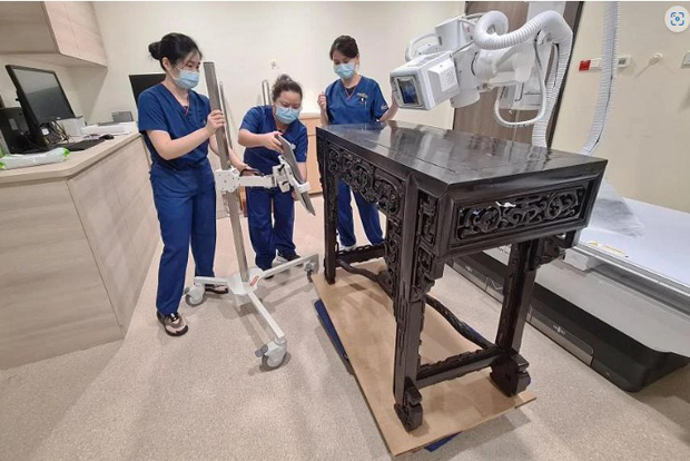  ​Sidetables from Panglima Prang, the ancestral home of Tan Kim Seng, undergoing X-ray scans at SGH on Nov 26, 2022. ST PHOTO FELINE LIM